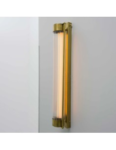 wall light with two metal rods in aged brass effect finish