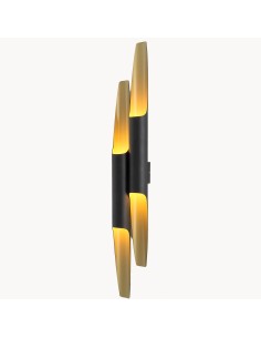 exterior wall light of the light is in a black finish and the interior in handmade gold