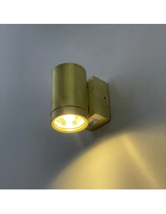 Wall light consisting of a cylindrical reading light in a handmade natural brass effect finish