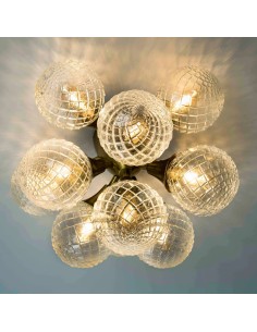 vintage recessed luminaire made up of 11 glass balls.