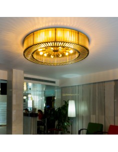 ceiling lamp with a circular metal structure in gold finish