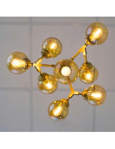 Vintage design ceiling lamp manufactured with a metal structure in antique brass finish.