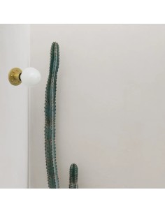 wall light with metal structure in brass color with studs with an LED bulb 2