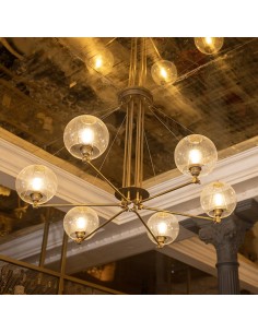 Brass ceiling lamp with adjustable arms and warm light