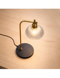 Elegant brass and glass table lamp next to mirror in classic bedroom 2