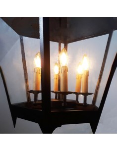 Black metal ceiling lantern with a traditional design, transparent glass panels and warm ambient lighting. 2