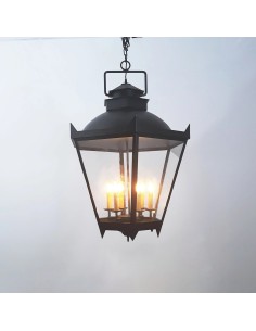 Black metal ceiling lantern with a traditional design, transparent glass panels and warm ambient lighting.
