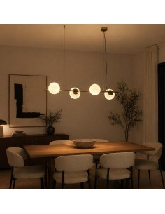 Close-up of a brass pendant lamp with opal glass spheres, featuring an elegant contemporary design. 2