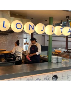 Custom linear pendant sign with seven illuminated glass globes spelling “LONJITA” 2