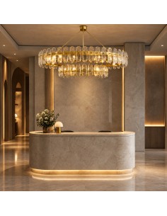 Florencia pendant light switched on, featuring a gold structure and a two-tier oval design. 2