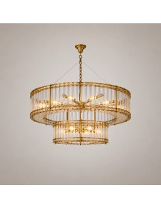 Round Air chandelier switched on, featuring a gold structure and crystal rods that enhance its two-tier design.